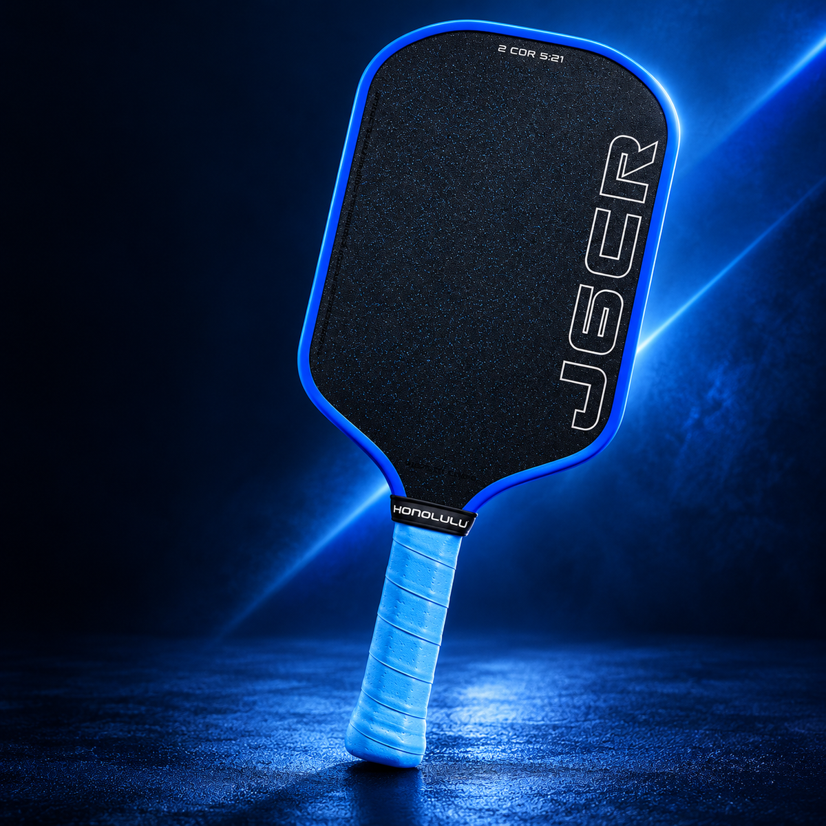 Honolulu J6CR blue paddle against an electric-blue studio backdrop